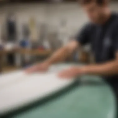 Demonstration of applying fiberglass resin on a surfboard