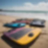 A variety of boogie boards displayed on a sandy beach