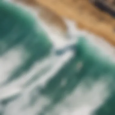 An aerial view of a bustling surf competition with waves in the background.