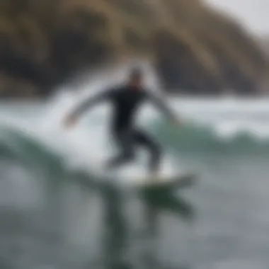 Surfer in action on winter waves wearing a high-performance wetsuit