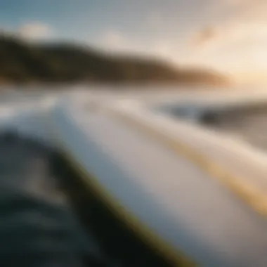 A close-up view of a wide surfboard showcasing its unique design features