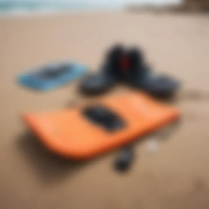 An array of bodyboarding equipment laid out on the sand