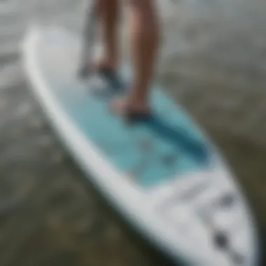 A close-up of a touring SUP board showcasing its streamlined design