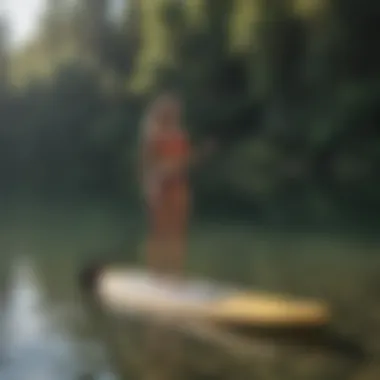Portability in Action: Carrying a Foldable Paddle Board A foldable paddle board being effortlessly carried to a serene lake.
