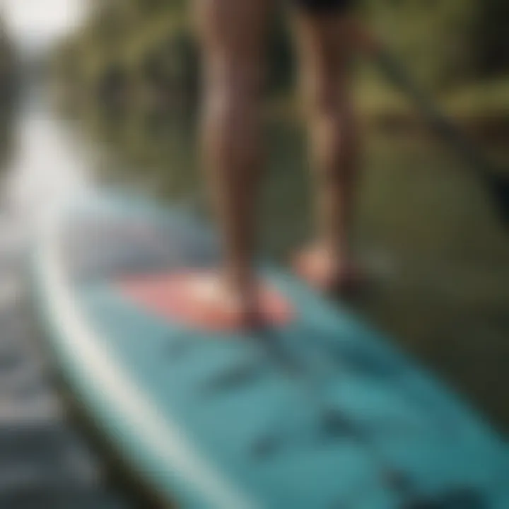 A close-up of paddleboard equipment showcasing the paddle and board features