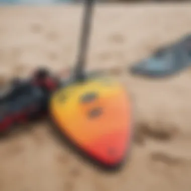 A close-up of kite surfing equipment laid out on the sand