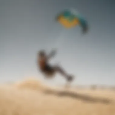 A vibrant landscape showcasing a kiteboarder expertly maneuvering on sandy terrain.