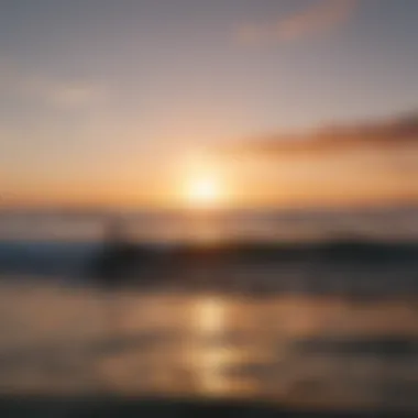 A picturesque sunset over the ocean with surfers silhouetted