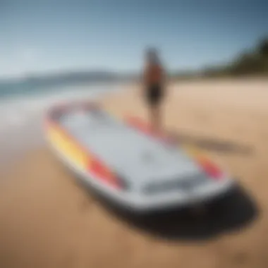 A well-maintained Naish inflatable wing board on a sandy beach, ready for the next adventure.