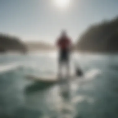 Navigating Ocean Conditions on a Paddle Board Paddle boarder navigating through ocean conditions
