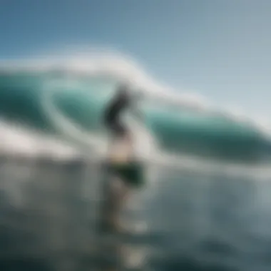 A paddle boarder riding a wave