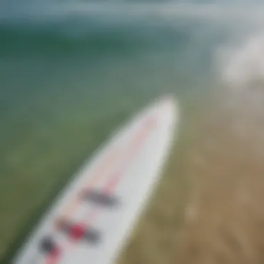 Paddle Board vs Surfboard Comparison Close-up of paddle board and surfboard comparison