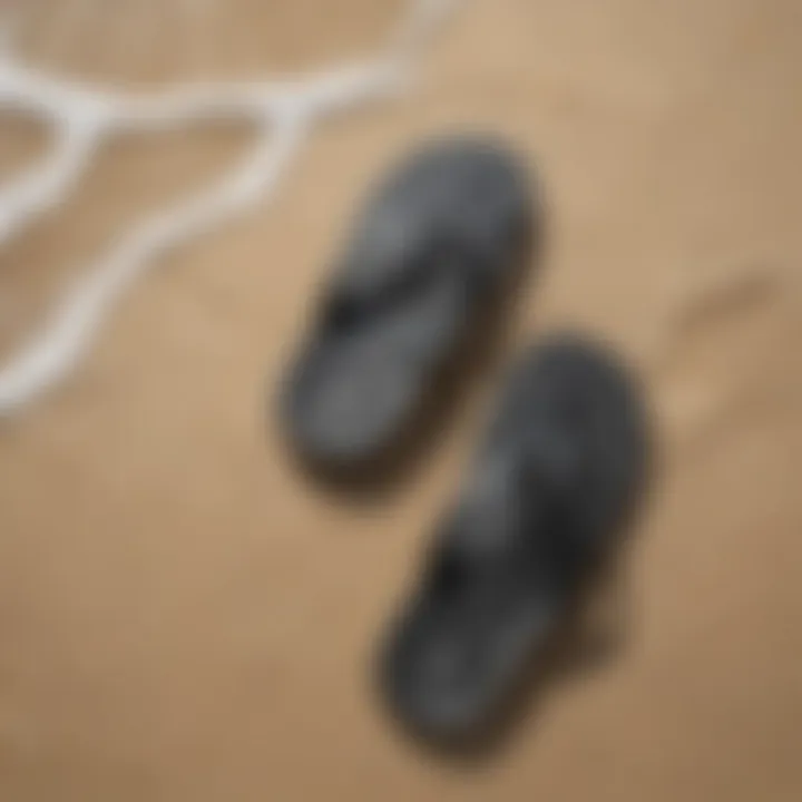 Flip flops on sandy beach with ocean waves