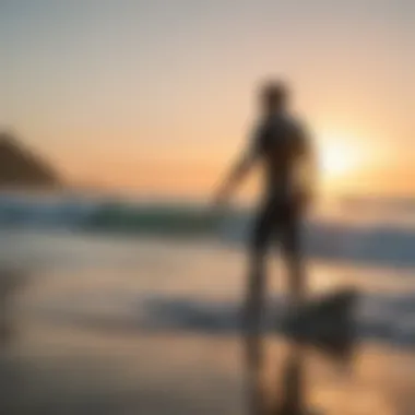 Instructor guiding a surfer in the ocean at dawn