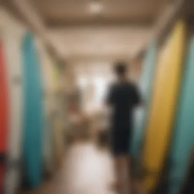 Shopping for Your First Surfboard An individual inspecting surfboards in a store