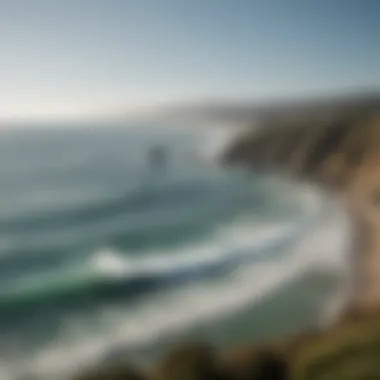 A picturesque view of the coastline with surfers in the water