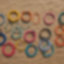 Colorful braided surfer bracelets displayed on a beach