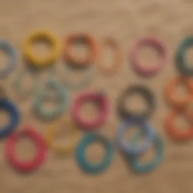 Colorful braided surfer bracelets displayed on a beach