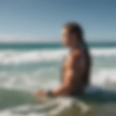 A surfer wearing braided bracelets while riding a wave