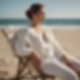 Elegant white beach sweater draped over a beach chair