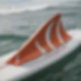 Close-up view of quad rear fins on a surfboard