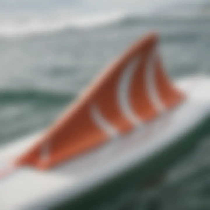 Close-up view of quad rear fins on a surfboard