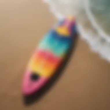 A sleek Wavestorm surfboard on the beach, showcasing its vibrant colors.