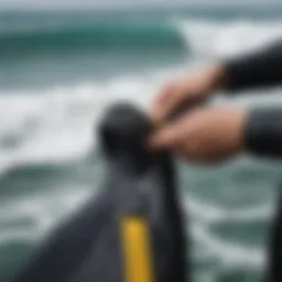 Close-up of a wetsuit measuring tape against a backdrop of ocean waves