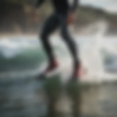 Surfer wearing Xcel surf booties in action on the waves